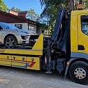 Car evacuation with the help of a tow truck.