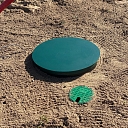 Water well with protective cover after installation