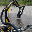 Cutting reeds and water grass