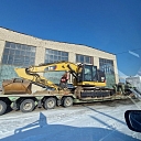 Road construction equipment transport
