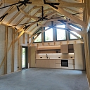 Modern wooden house interior with high ceilings and beams