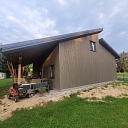 Wooden facade decoration and energy-efficient house construction