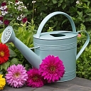 Watering can in a flower bed