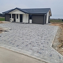 Paving the courtyard of a private house with multi-colored paving stones