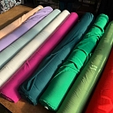 A variety of cotton and clothing fabrics in different colors