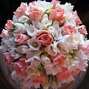 A bouquet of roses and freesias