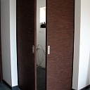 Sliding corner door