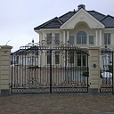 Forged baroque gate, fence and railing with gold patina in Marupe