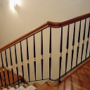 Classic stair railing with polished brass accents in a private house in Vecaki