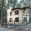 Classic forged fence and railing with vertical posts in a new building in Jurmala