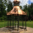 Bird pavilion with a copper roof in the park of Aluksne Castle
