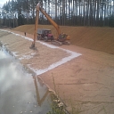 Coastal slope reservoir construction