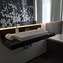 Bathroom surface with sink made of Corian ® and Meganite ® materials