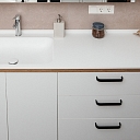 Bathroom surface with sink made of Corian ® artificial stone