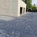 Paved yard next to the garage