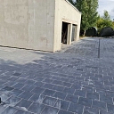 Paved yard next to the garage