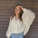 Comfort and elegance in a handmade white sweater.