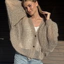Soft, luxurious sweaters in various pastel colors.
