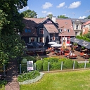 The outdoor terrace of the Postman's House is the perfect place for a leisurely meal in warm weather.