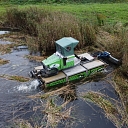 Pond cleaning from overgrowth