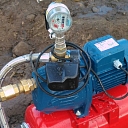 Close-up of water pump and pressure gauge