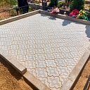 Grave with ceramic tiles