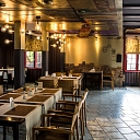 The interior of the Postman's House restaurant offers a cozy and elegant environment for quiet meals and formal evenings.