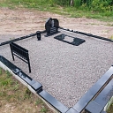 Graveyard with black granite monument