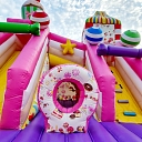 Inflatable attractions with a slide