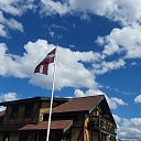 Latvian flag in the yard of a private house