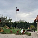 Latvian flag in the yard of a private house