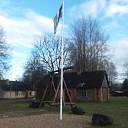 Latvian flag in the yard of a private house
