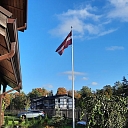 Latvian flag in the yard of a private house