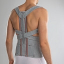 Back posture corrector with metal inserts