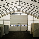 Lifting gate for tent hangar