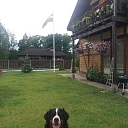 Latvian flag in the yard of a private house