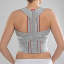 Posture corrector with metal inserts