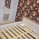 Assembling a bed and wardrobe in the bedroom.