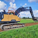 "Valmiera roads" Volvo excavator working on gravel road construction in Vidzeme.