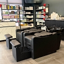 Hair washing area with comfortable chairs.