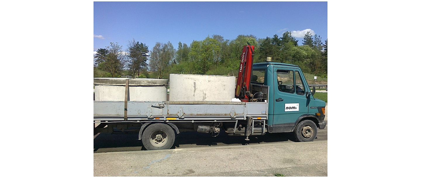 We transport sewage pipes, lids and rests