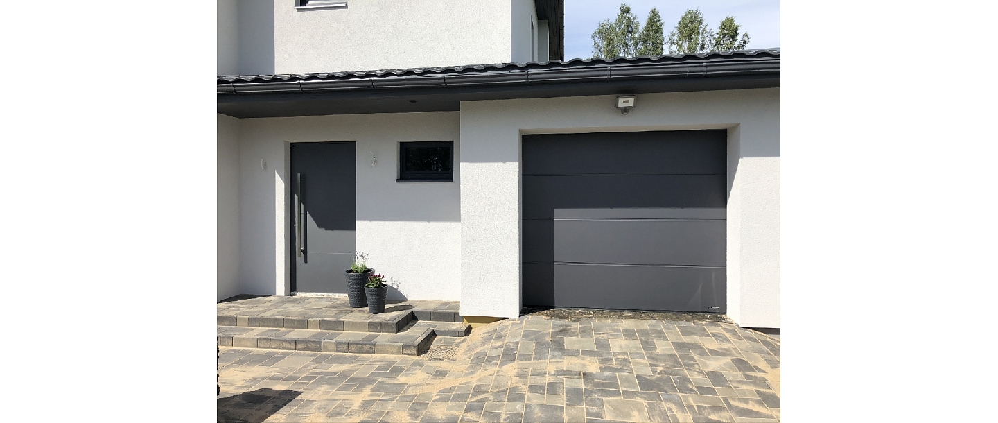 Wisniowski garage door in the same style as the front door