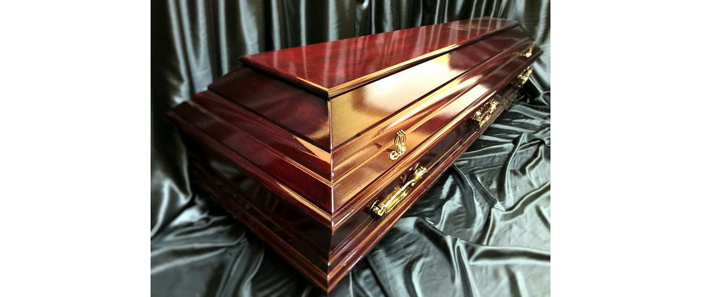 A wooden coffin, glossy varnished