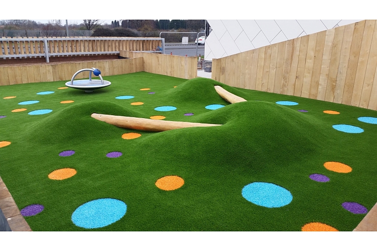 Laying of artificial grass