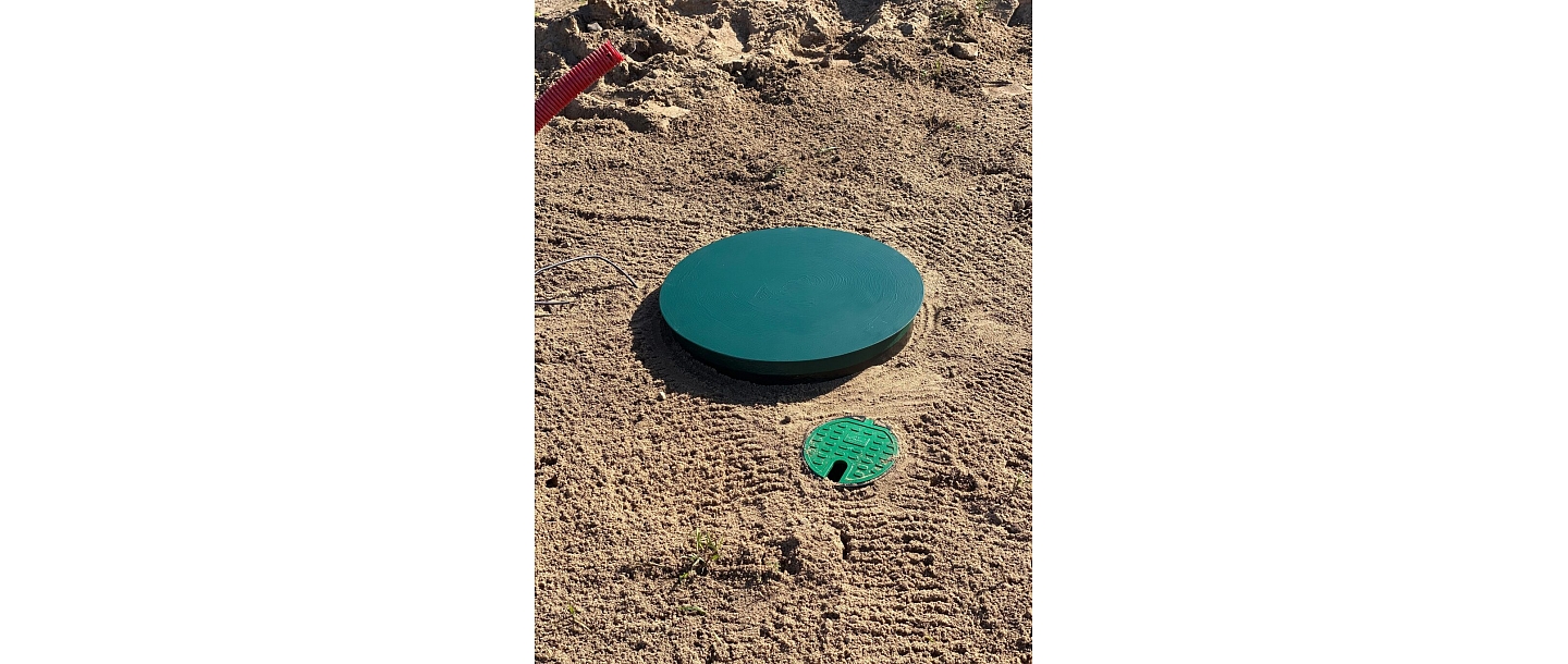 Water well with protective cover after installation