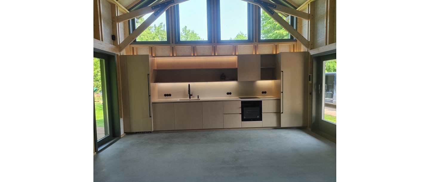 Wooden house kitchen area with individual design and lighting