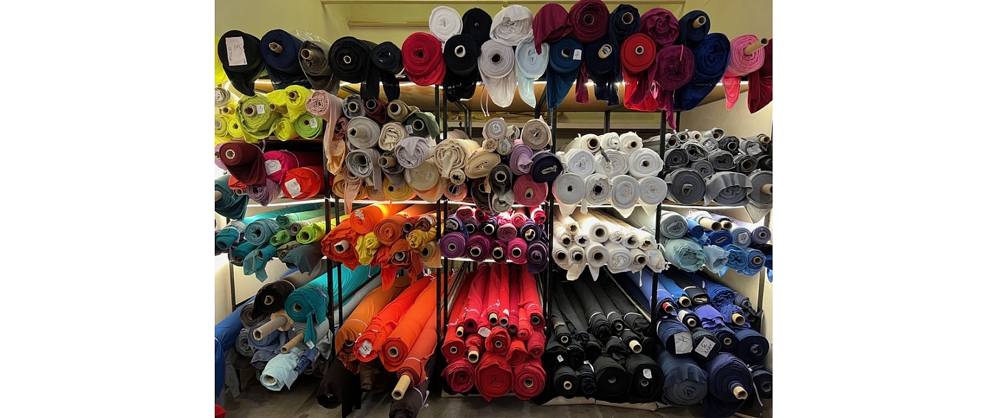 Rolls of fabric of various colors wholesale in Latvia