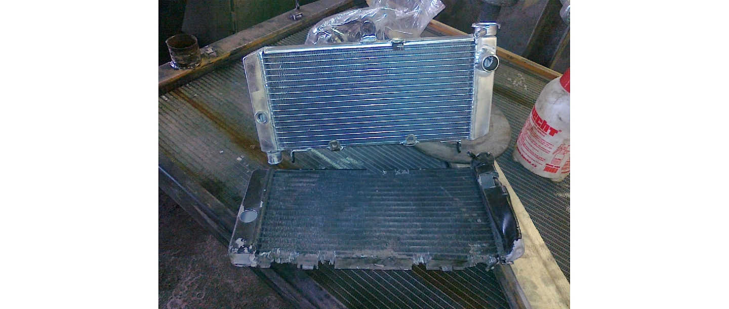 Straightening and repairing damaged car radiators