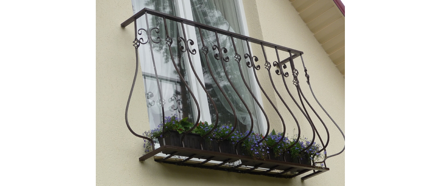 Decorative wrought metal balcony railings in Daugavpils
