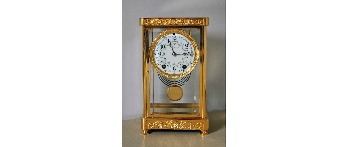 19th century. gilded table clock - restored